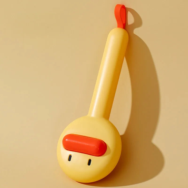 Small yellow duck-shaped pet grooming comb with open sections for cats and dogs