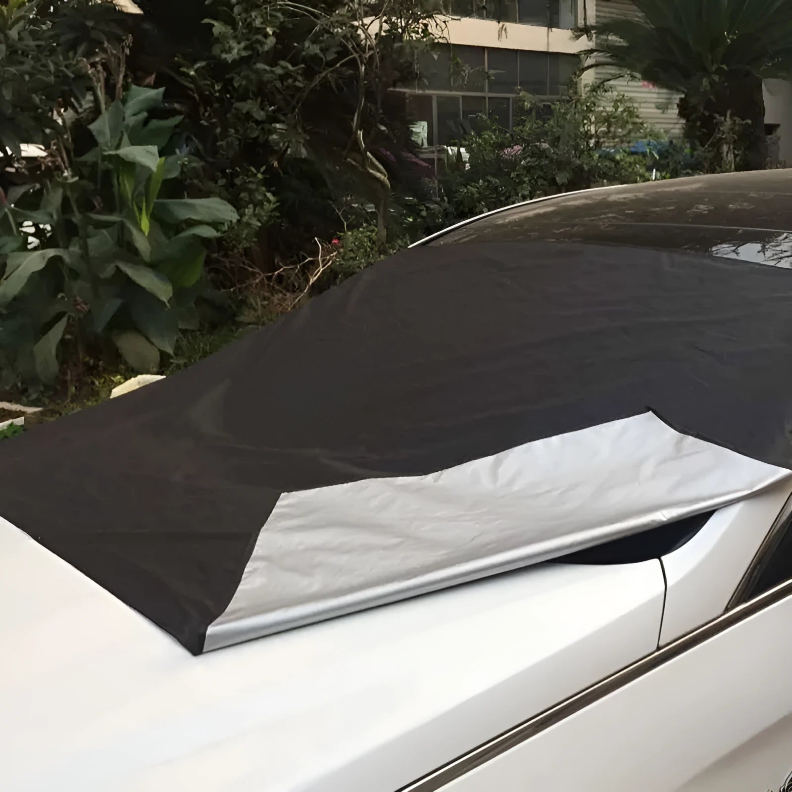 Magnetic car windscreen snow cover in black with silver back, 210x120cm size, six magnets visible