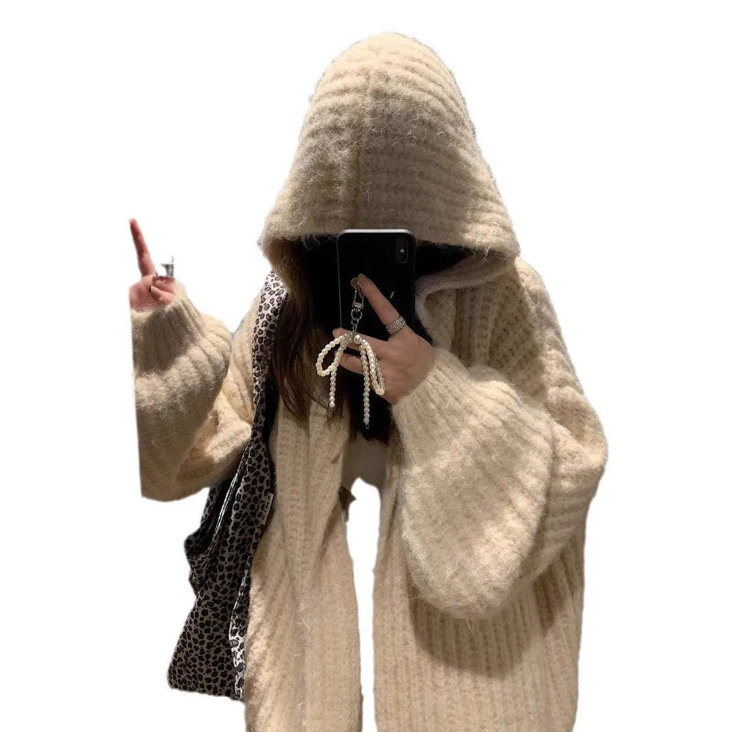 Women's loose grey hooded cardigan with a thick knit and oversized fit on a hanger.