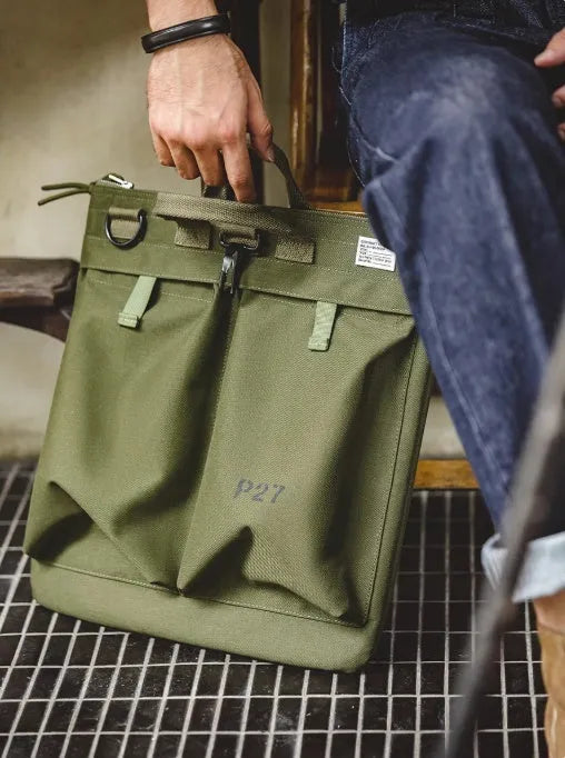 Marden Tooling canvas crossbody bag in military green with laptop compartment showing retro styling