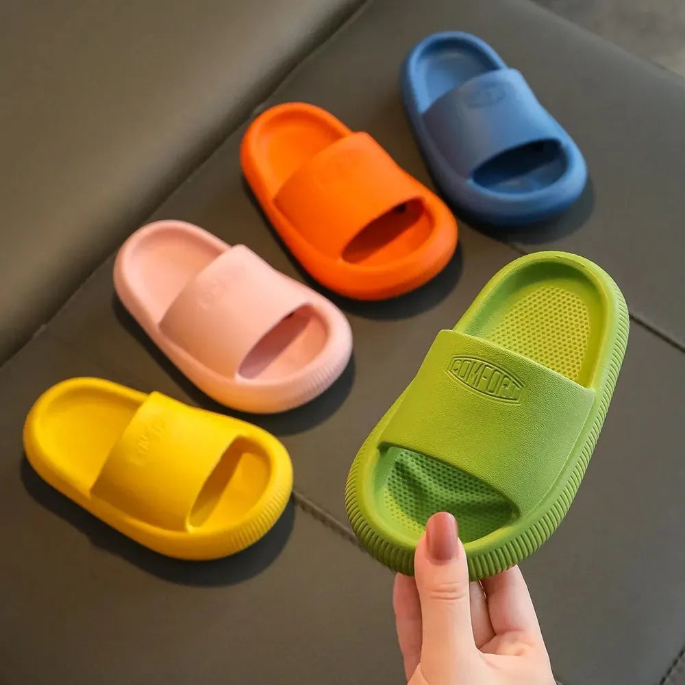 Children's colourful EVA slippers with a textured non-slip sole, shown in a mixed colour selection.