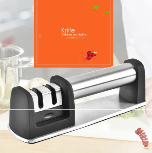 A black manual kitchen knife sharpener made from ABS plastic with an integrated handle.