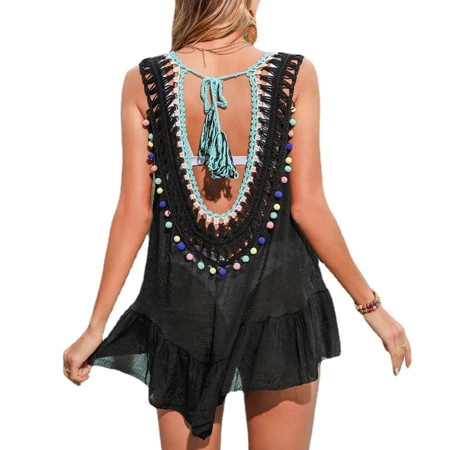 Black women's beach cover-up with cut-out ruffle design made from acrylic fabric with polyester lining