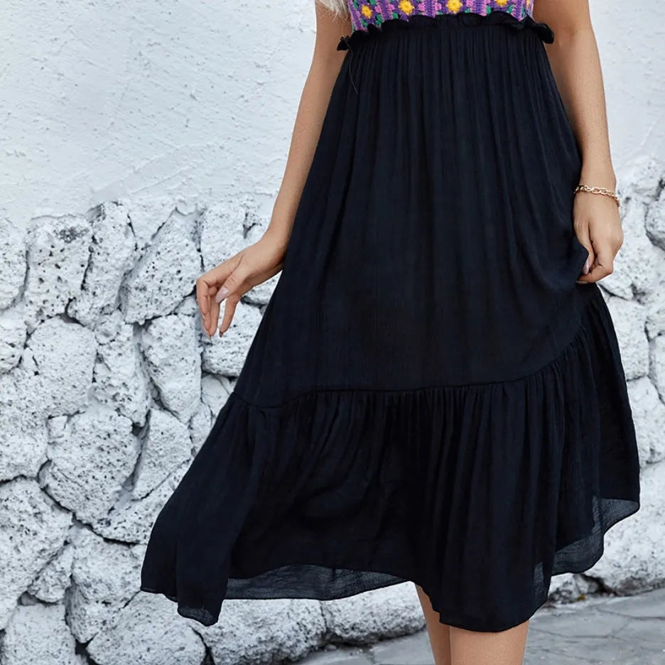 Purple sleeveless dress with hand-hooked white floral stitching pattern on the front.