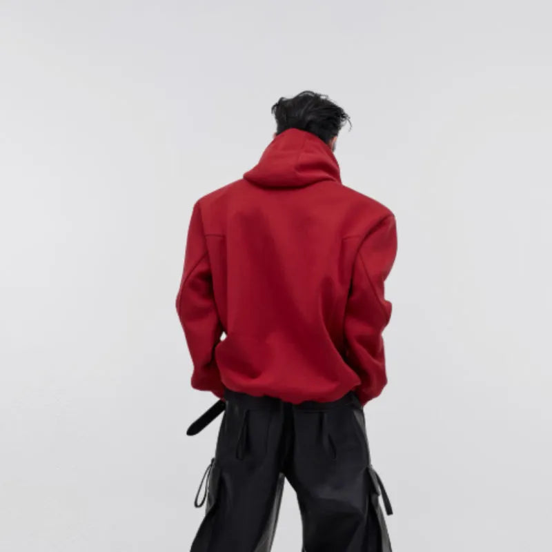 Men's red loose hoodie with metal printed heavy shoulder pads and a zip-up hood.