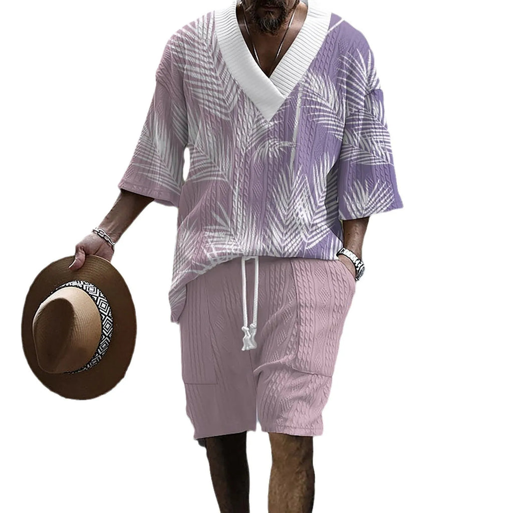 Men's grey knitted short-sleeved drop-shoulder top with matching shorts laid flat.