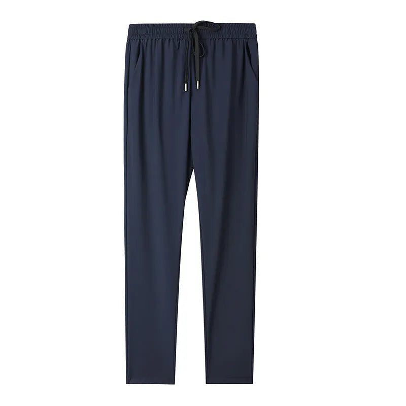 Grey hooded sun-protective top and trousers casual set laid flat showing loose fit and pocket detail