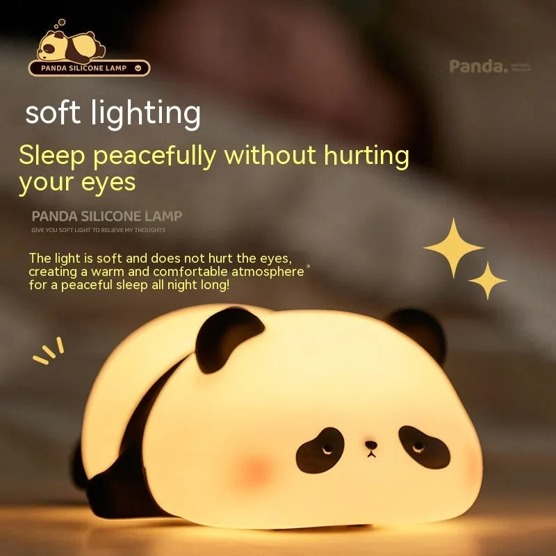 Cartoon panda-shaped silicone night light for children on a table.
