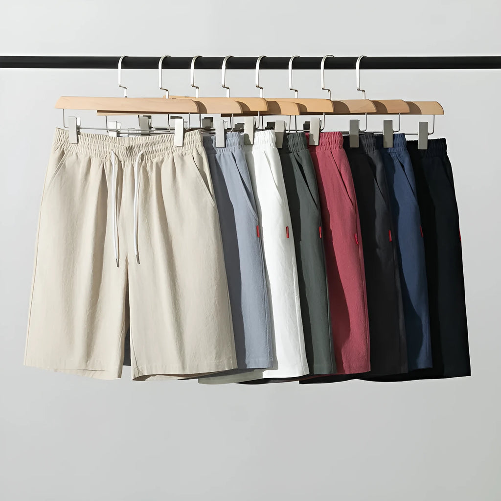 Solid colour cropped cotton linen trousers with a drawstring waist, shown in army green.