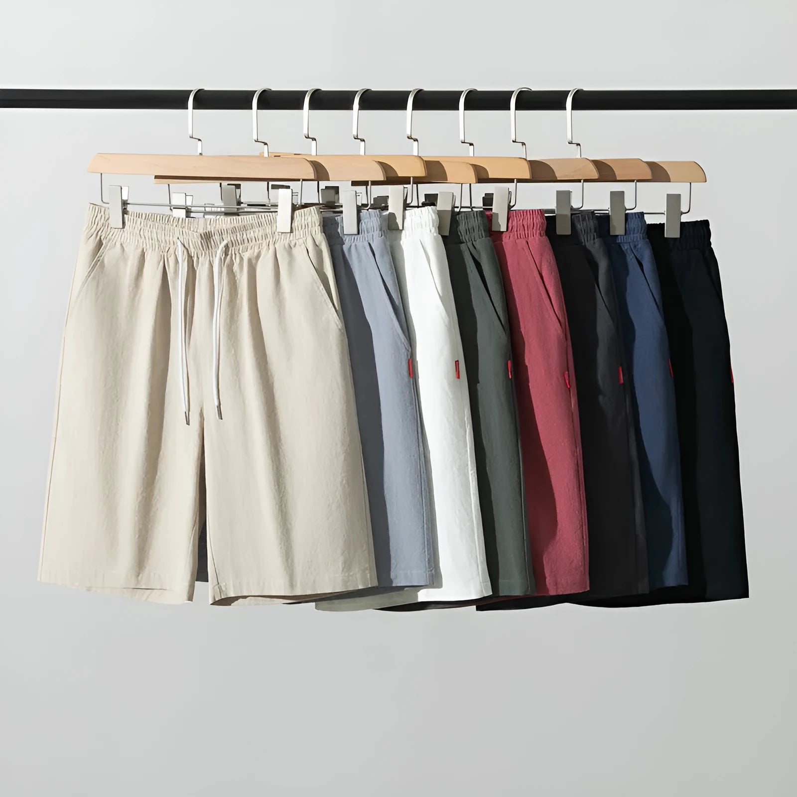 Solid colour cropped cotton linen trousers with a drawstring waist, shown in army green.