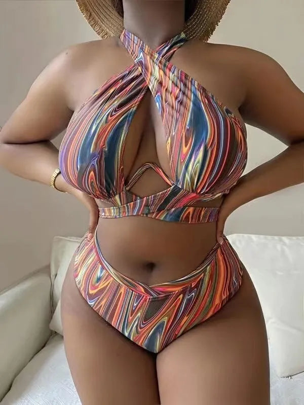 Women's floral high-waist bikini swimsuit top and pants in plus sizes.