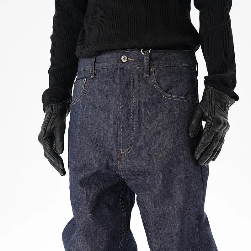 A pair of dark blue loose straight-cut jeans laid flat, showing the front design.