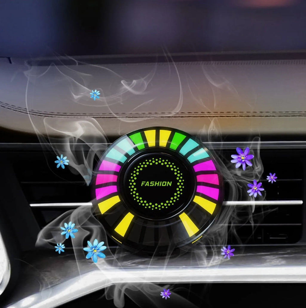Car air vent aromatherapy unit with colourful RGB lights and choice of scent styles.