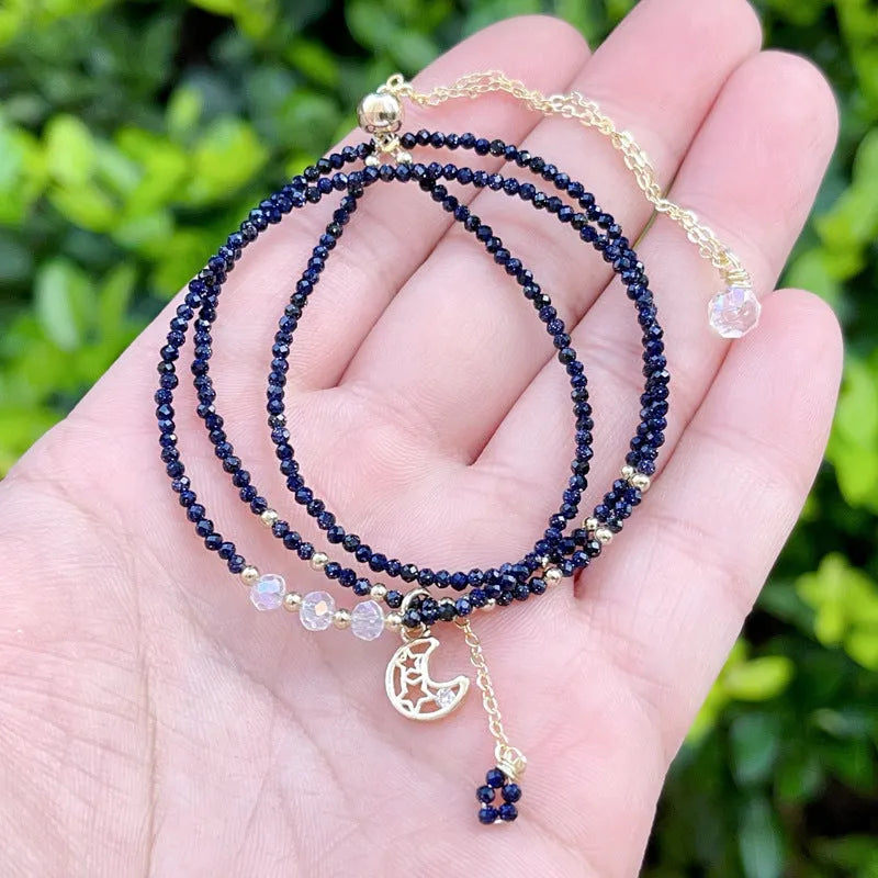Blue gold three-ring women's bracelet with blue sand stone gemstone on adjustable fastening