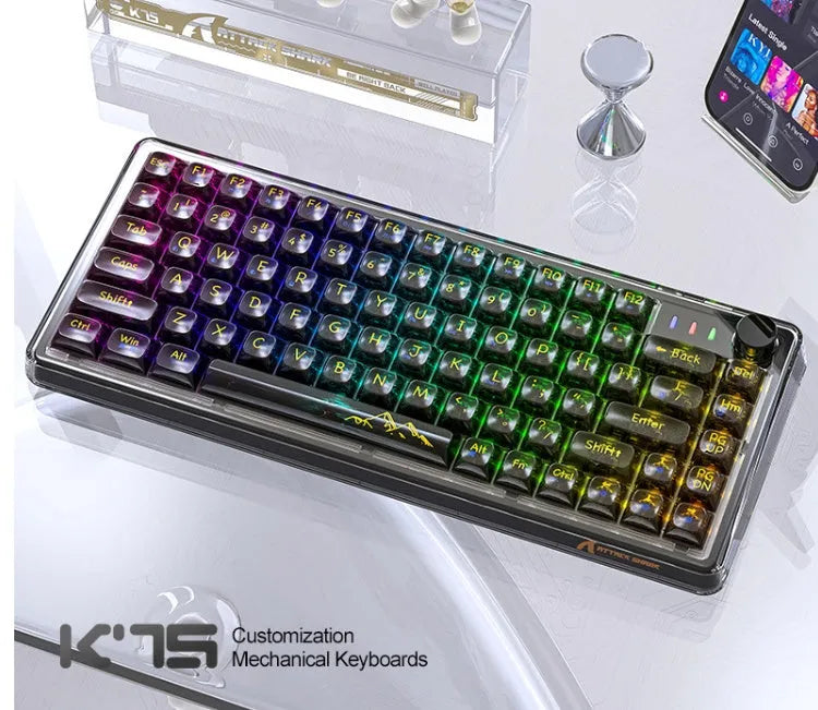 Attack Shark K75 wireless mechanical keyboard with transparent black case showing internal components and RGB lighting