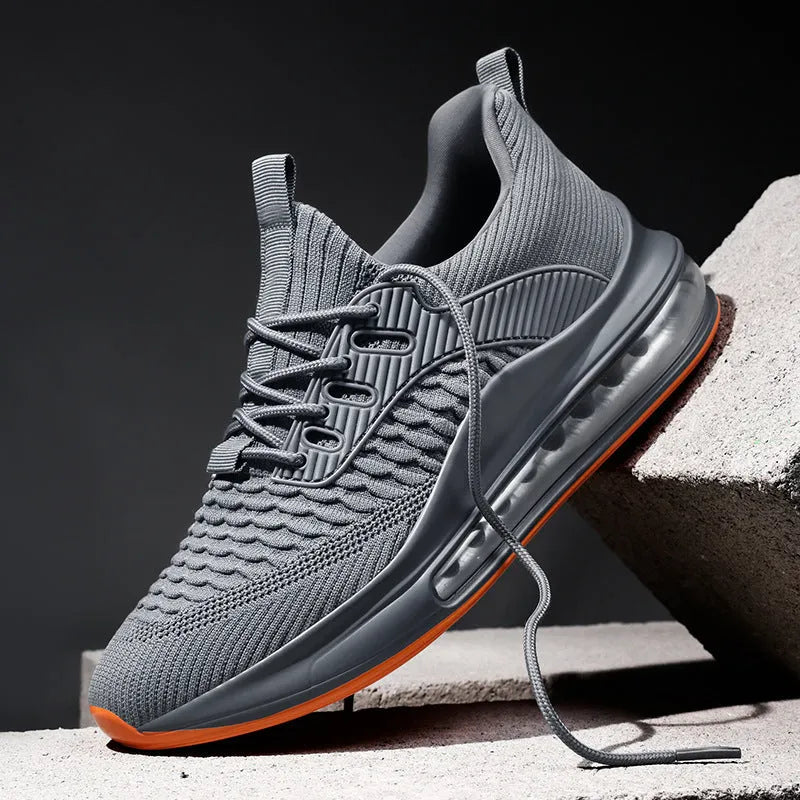 Men's black mesh running shoes with rubber sole and low-top design for sports activities