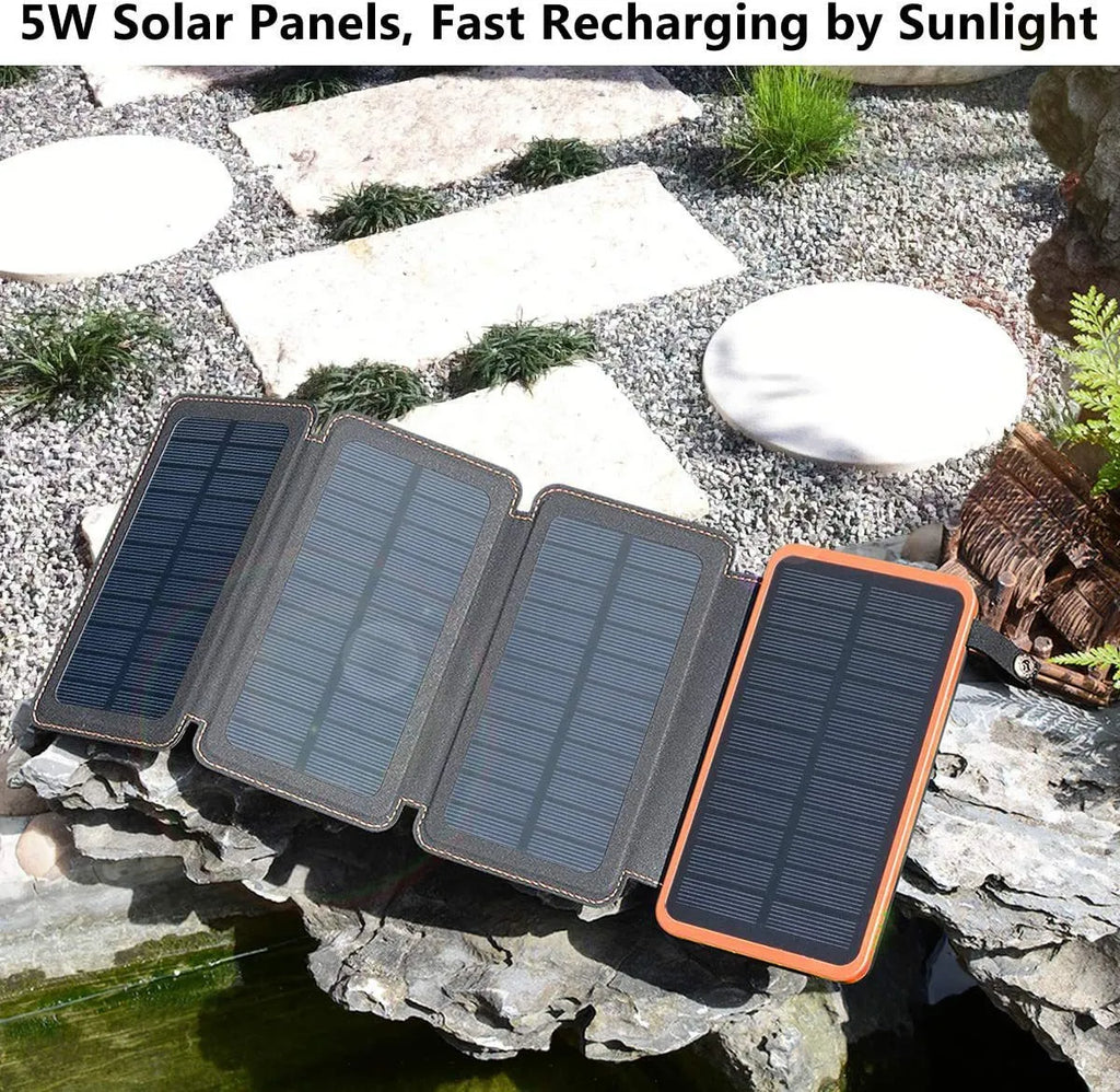 Black outdoor solar power bank with a solar panel, USB ports, and an LED light on a soft leather exterior.