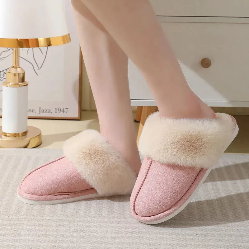 Women's plush winter slippers with artificial wool lining and a PVC sole in multiple colours.