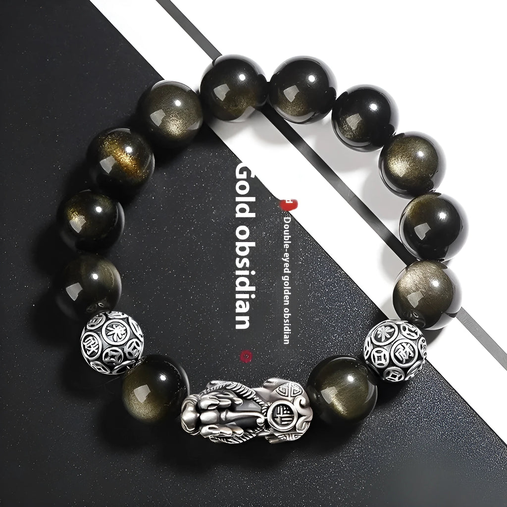 Men's geometric bracelet with obsidian stone set in 999 sterling silver on a wrist.