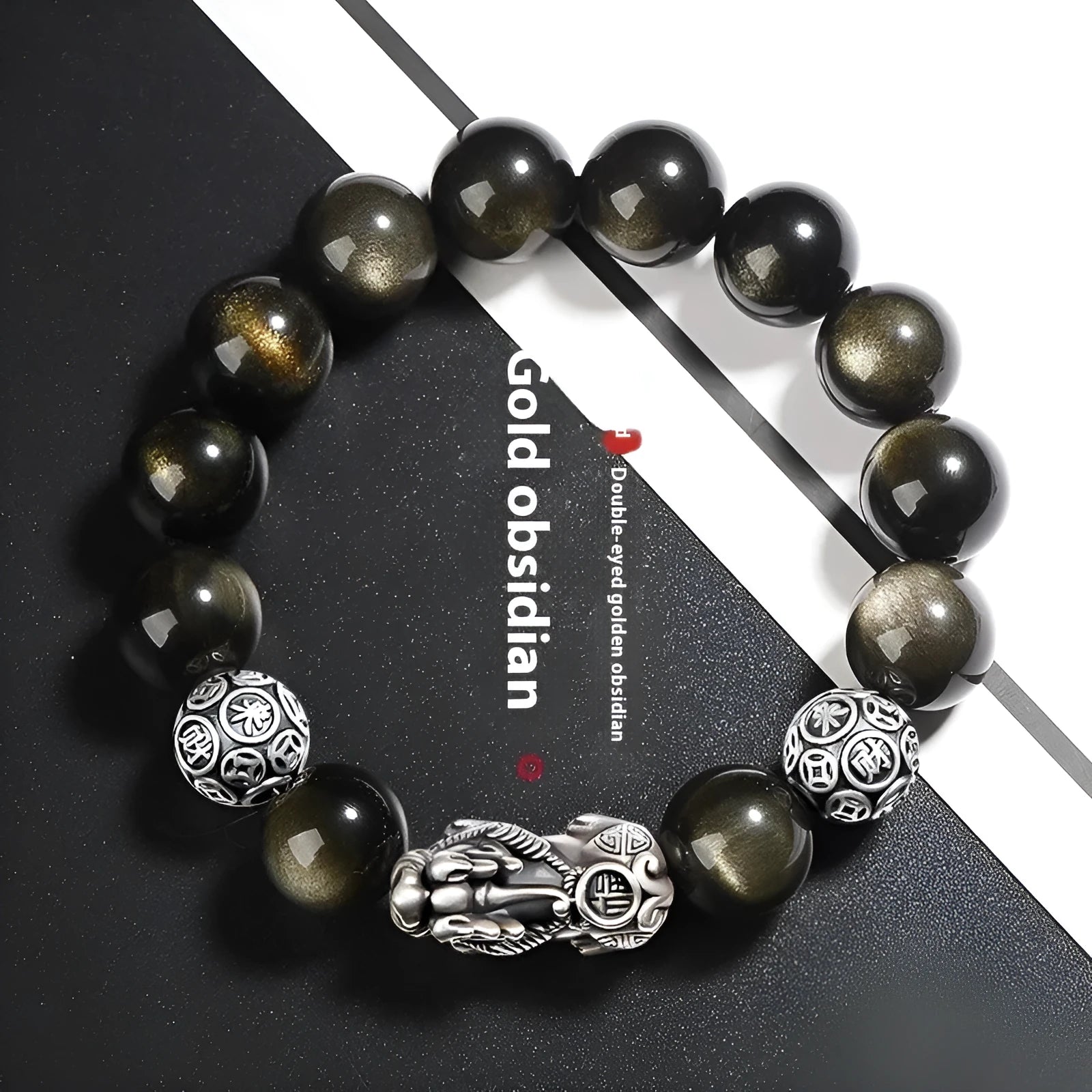 Men's geometric bracelet with obsidian stone set in 999 sterling silver on a wrist.