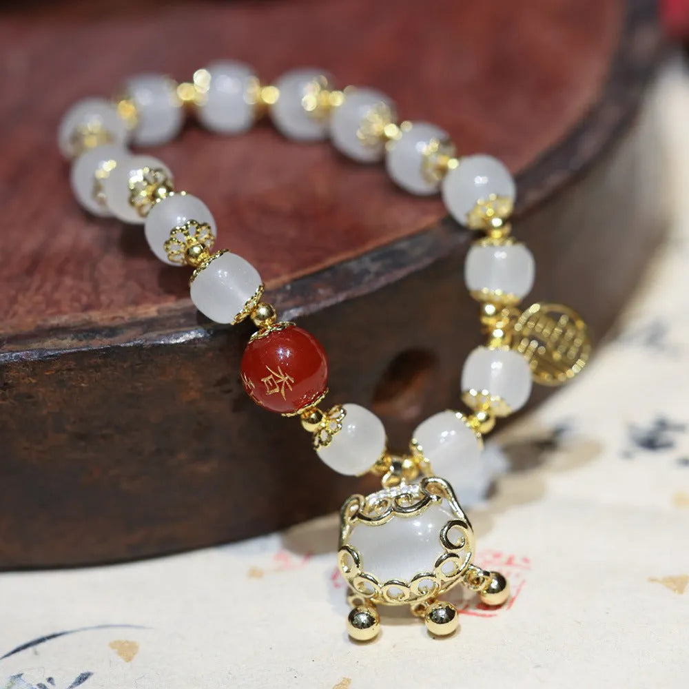 Women's Chinese style glass bracelet with Fu character and safety lock design in coloured glaze