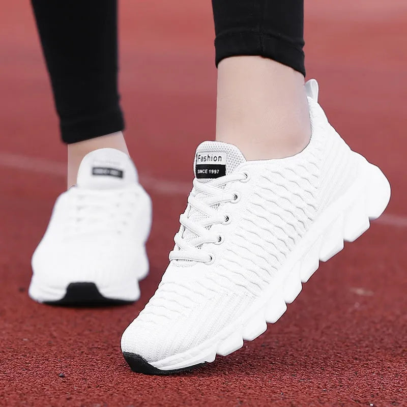 Women's running shoes with fly weaving upper in black, pink, or white colours showing wear-resistant outsole