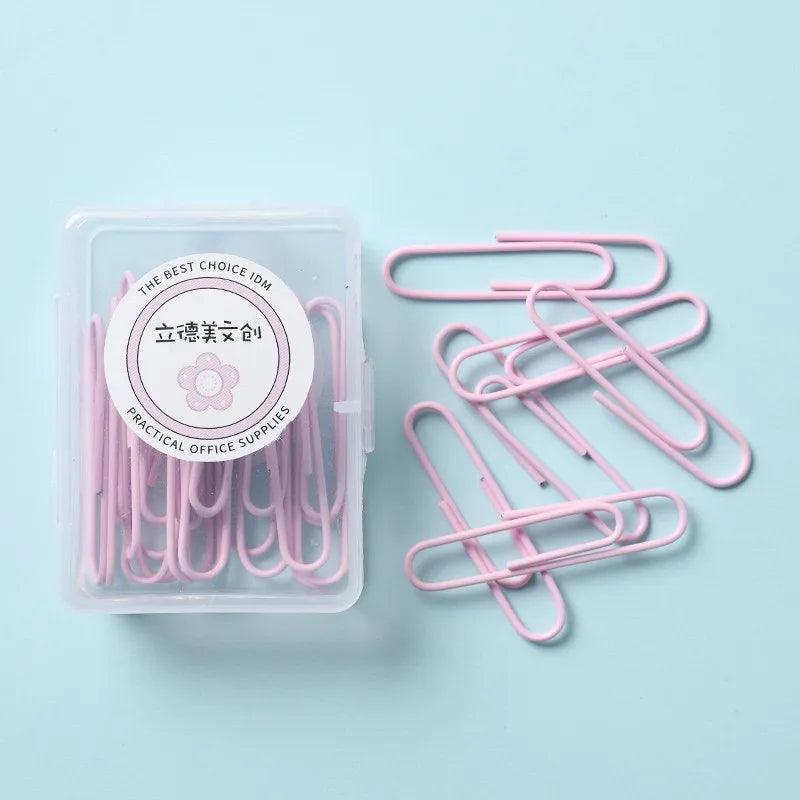 Set of macaron colour alloy paper clips in pink, green, and purple, showing 28mm and 50mm sizes, on a light background