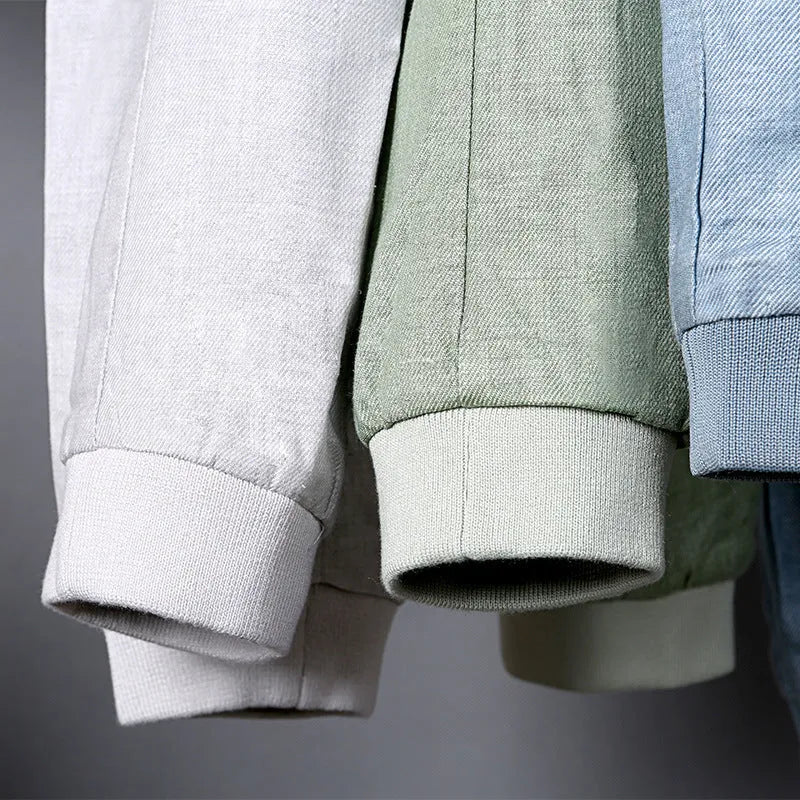 Men's thin colour block linen jacket in blue, grass green, or heather grey on a hanger.