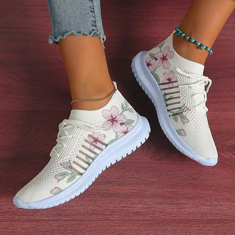 Women's Milky White mesh Flyknit running shoes with flat heel and round toe on a rubber sole.