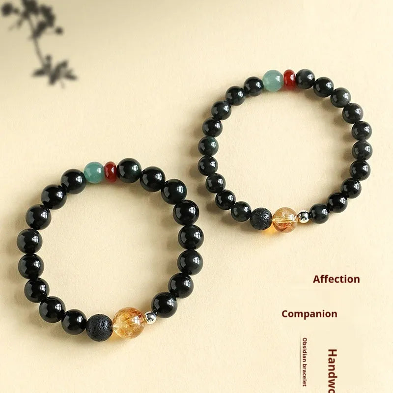 Chinese style obsidian and agate couple bracelet with yellow tower crystal and jade beads.