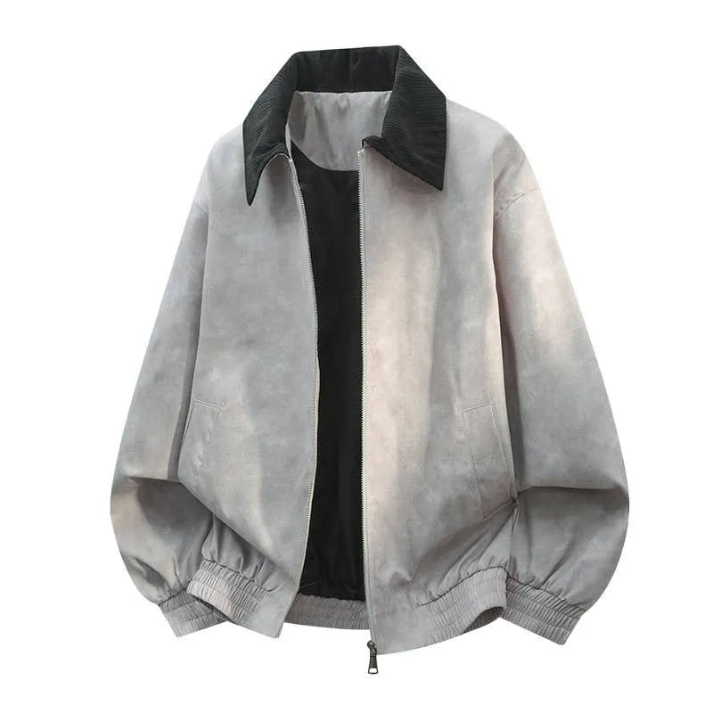 Man wearing a grey casual jacket with a detailed stitching lapel collar and side seam pockets.