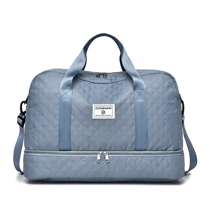 Large Oxford cloth travel holdall in a solid colour, shown with a capacity of 36-55 litres for buggies and luggage.