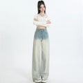 Gradient blue women's straight-leg denim trousers on a hanger, showing colour transition.