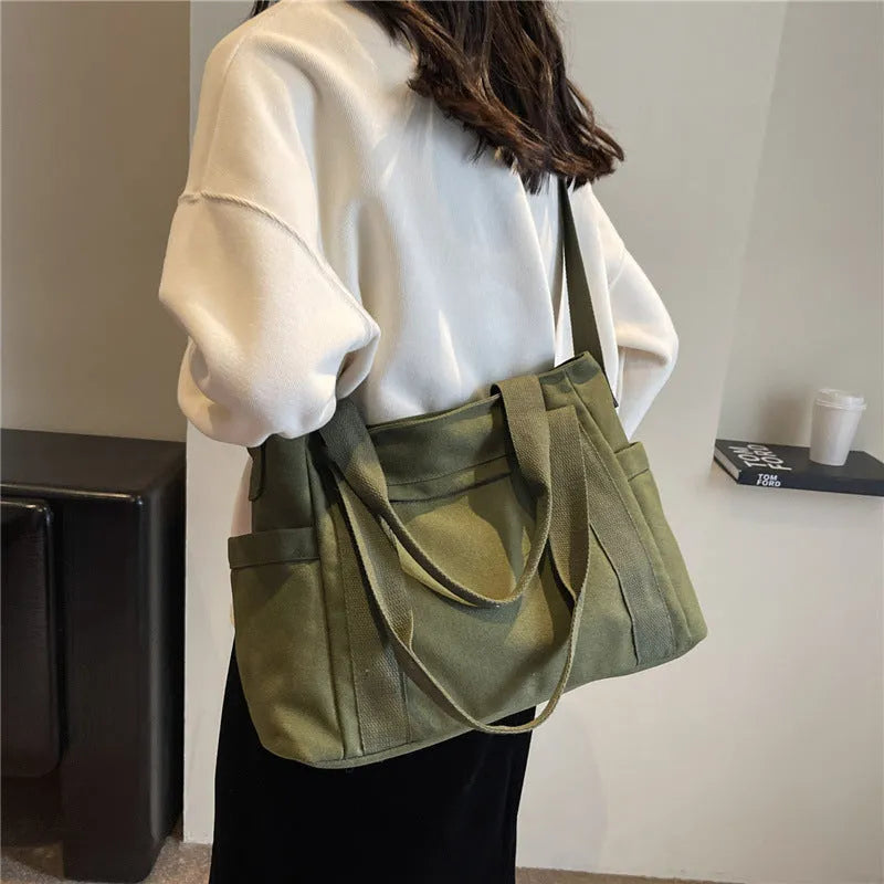 Large capacity canvas shoulder bag with sandwich pocket design in solid colour options