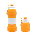 Blue silicone folding water bottle shown at full height and collapsed height next to a backpack