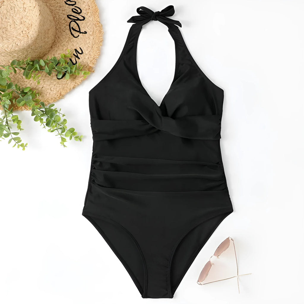 Women's solid colour one-piece swimsuit with cross front design in polyester fabric.