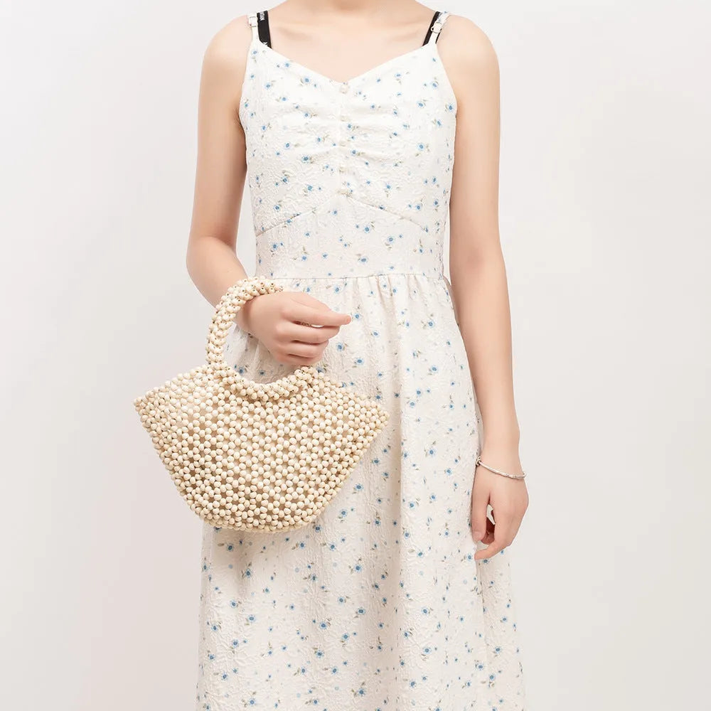 Maple wood hand-woven seaside handbag with wooden beads in dumpling shape