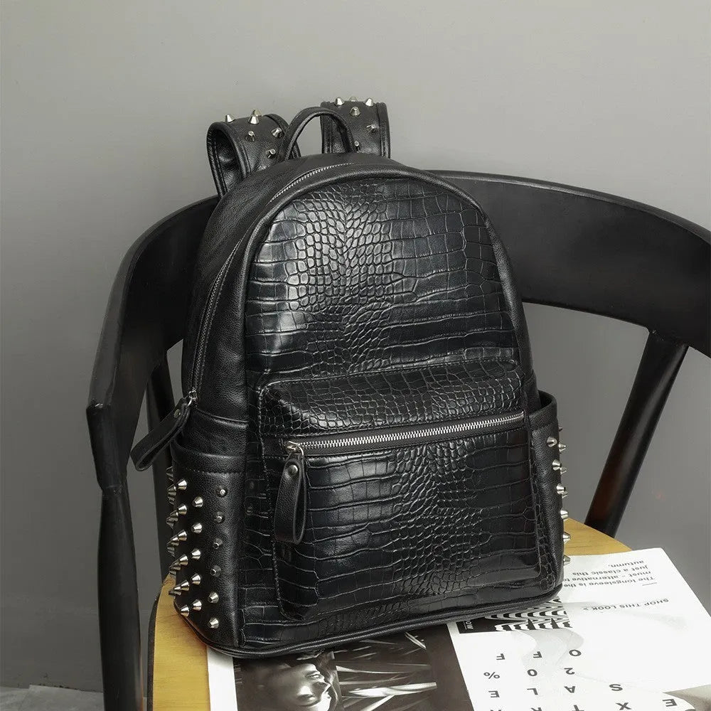 Black waterproof computer schoolbag with 55L capacity and decorative rivet details