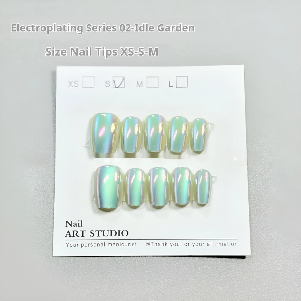 Electroplating Cat's Eye 02 Idle Court false nails with Aurora effect in short ladder sizes on a hand.