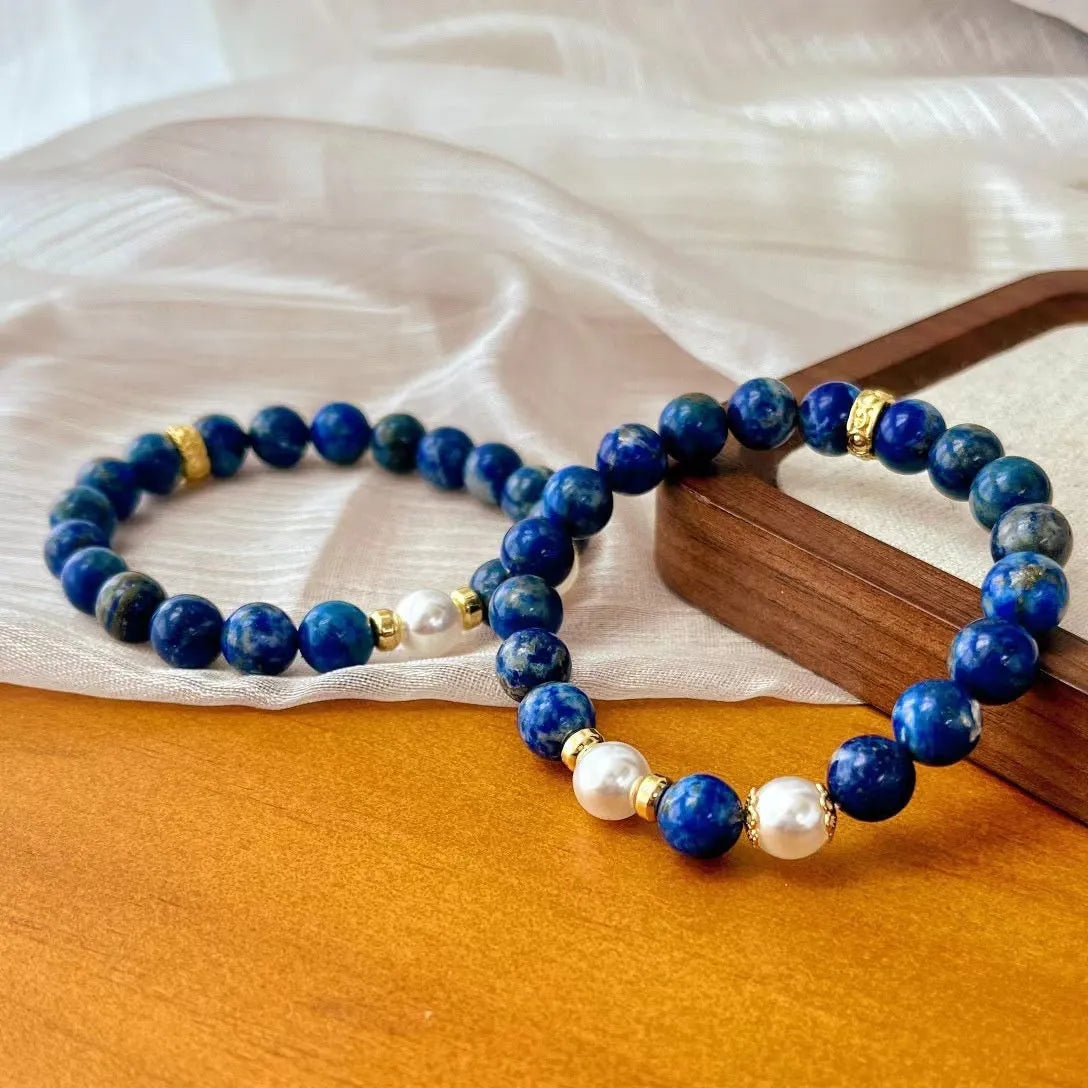 Chinese-style artistic retro lapis lazuli bracelet with green and gold stone on a white background.
