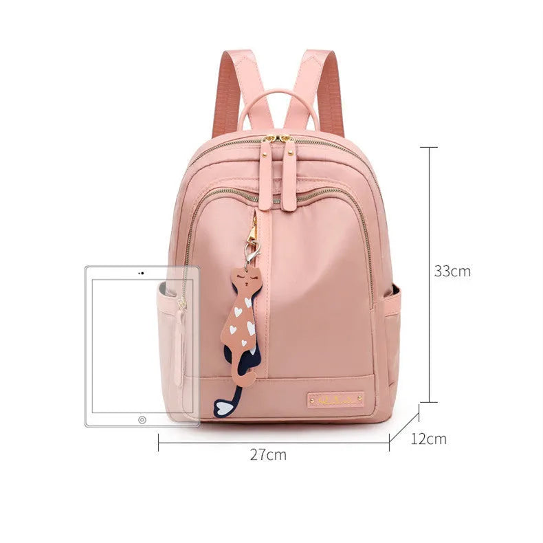 Black and pink women's casual nylon backpack showing soft surface and shoulder straps