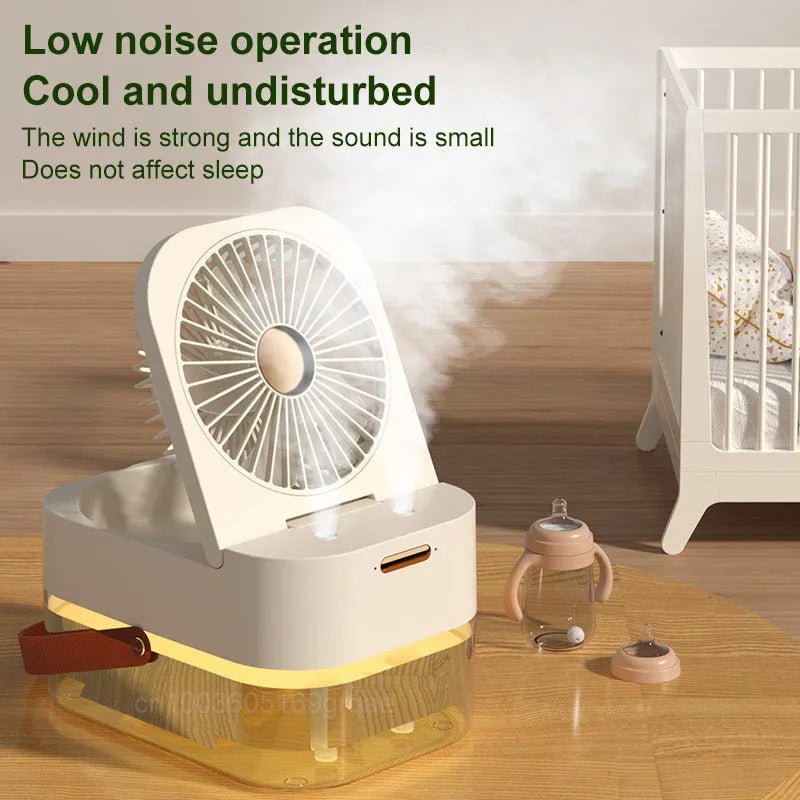 Pearl white portable USB desk fan with humidifier mist and soft night light on a wooden desk.