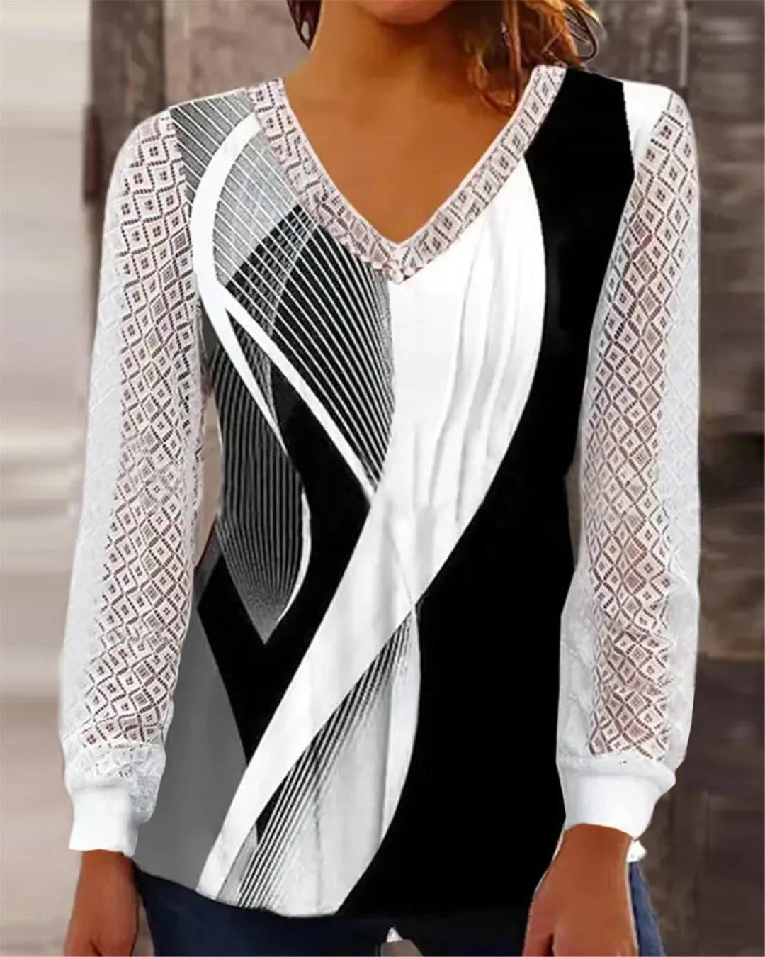 Women's v-neck loose top with hollow-out lace print in purple colour showing front view