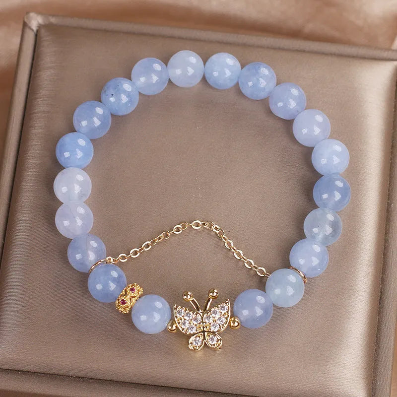Sky blue aquamarine butterfly crystal bracelet with pearls and rhinestones measuring 17cm length