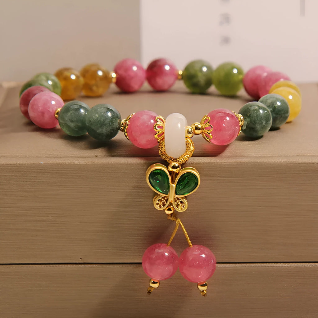Tourmaline butterfly pendant bracelet with natural jade colour accents and rhinestone details on adjustable alloy chain