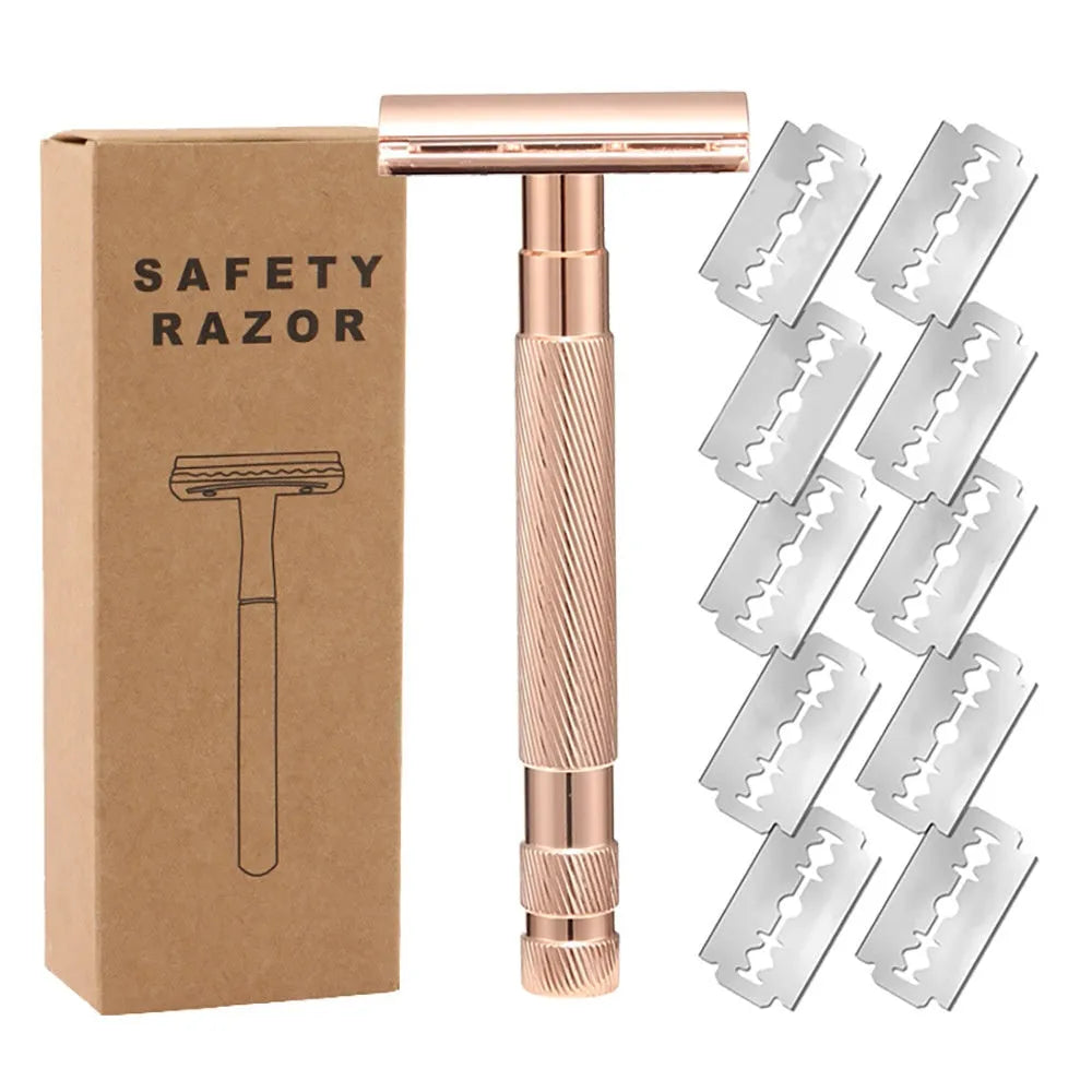 Old style manual double-sided safety razor in alloy with spare blades on a dark background.
