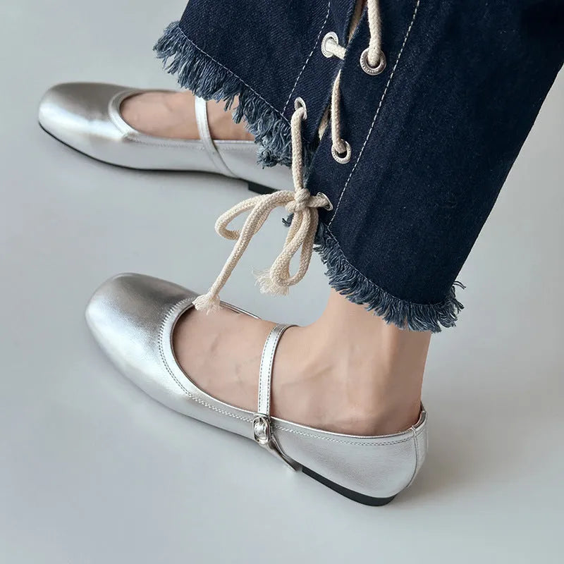 Retro style Mary Jane flat shoes in sheepskin with pigskin lining, shown in a solid colour with round toe and low heel.