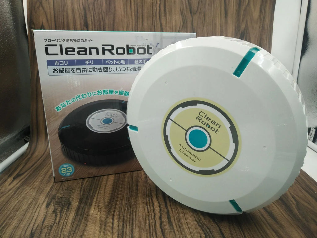 Black and white ABS plastic automatic robot vacuum cleaner on a wooden floor.