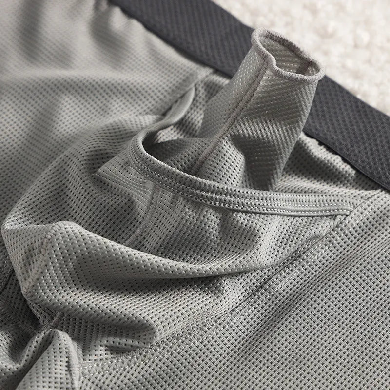 Men's ice silk nylon boxer underwear in black colour showing low-waist design and mesh breathable panels