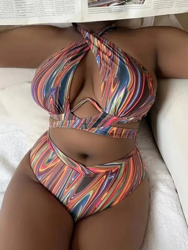 Women's floral high-waist bikini swimsuit top and pants in plus sizes.